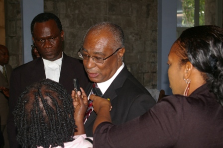 Premier of Nevis, Hon. Joseph Parry and his lawyer, Mr. Oral Martin talking to reporters.